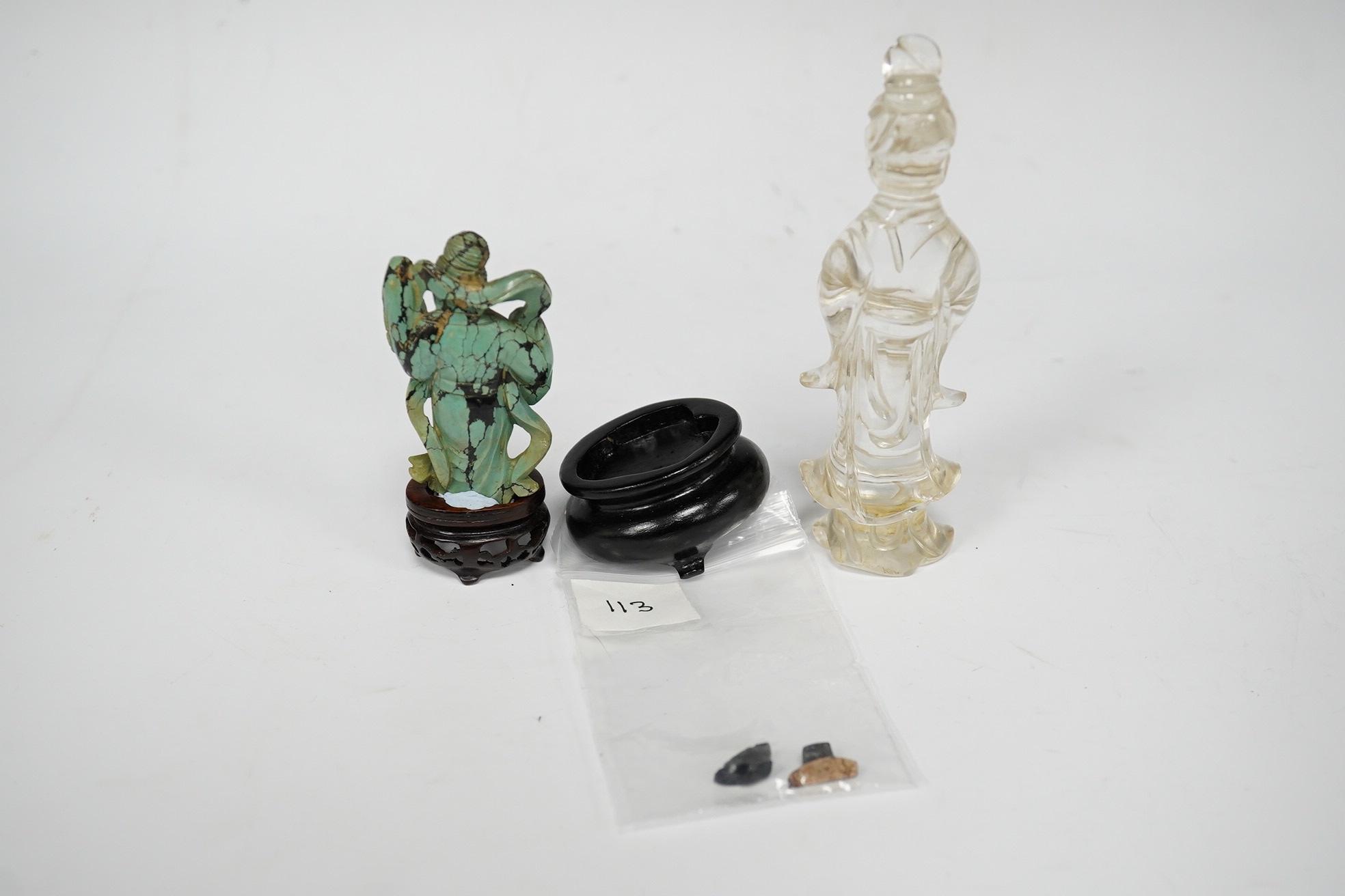 A Chinese rock crystal standing figure of Guanyin and a turquoise matrix figure of a lady, largest 12cm high (2). Condition - fair